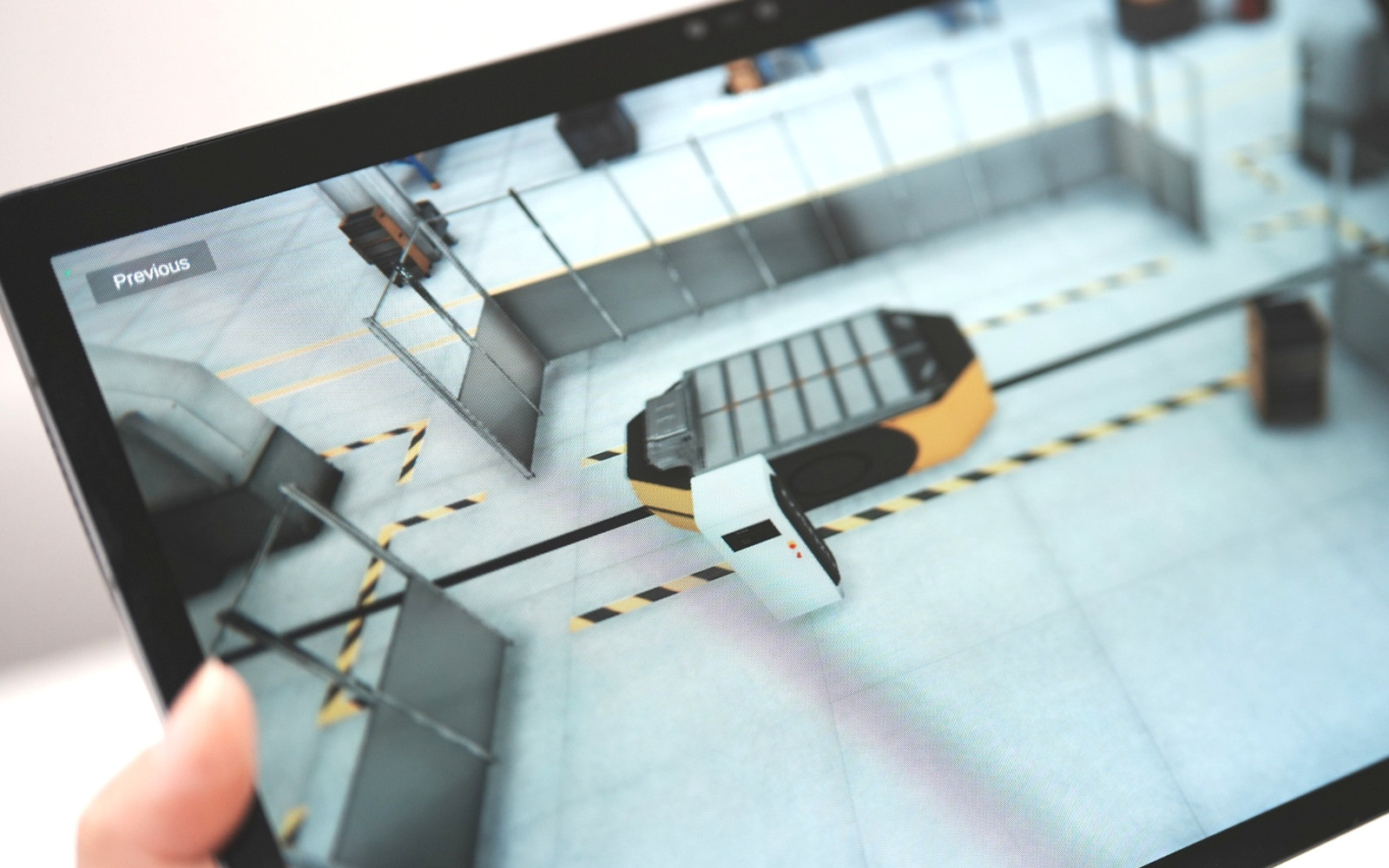 Tablet showing a 3D digital-twin factory floor simulation