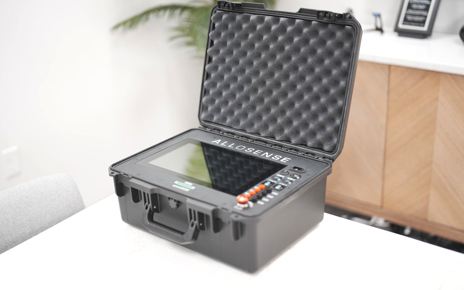 Open rugged AlloSense portable tester case with screen and buttons